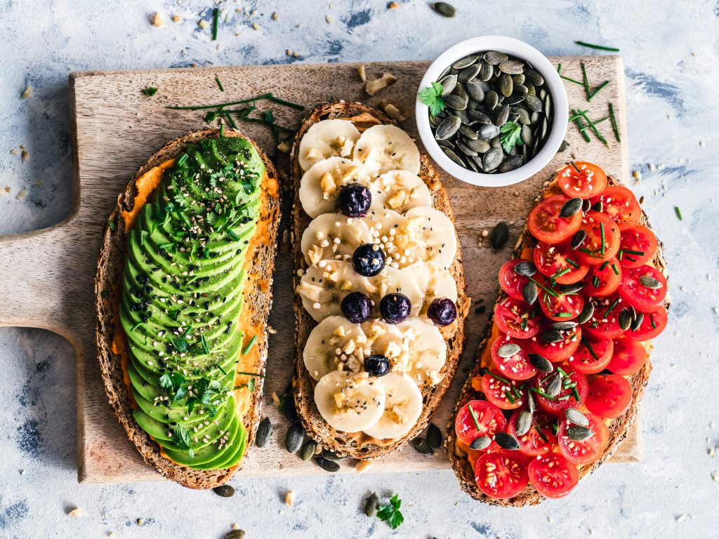image of three toasties with avocado bananas and tomatoes